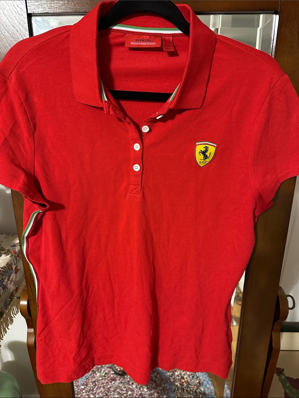Official Scuderia Ferrari women's piqué racing polo shirt.